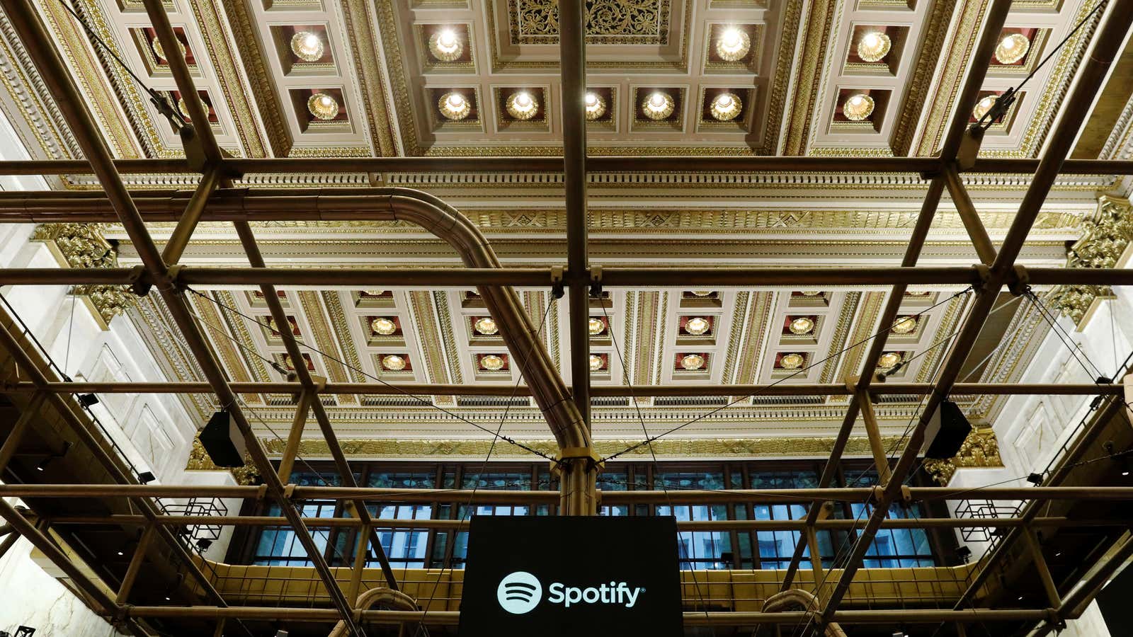 The Spotify logo is displayed as the stock waits to begin selling as a direct listing on the floor of the New York Stock Exchange…