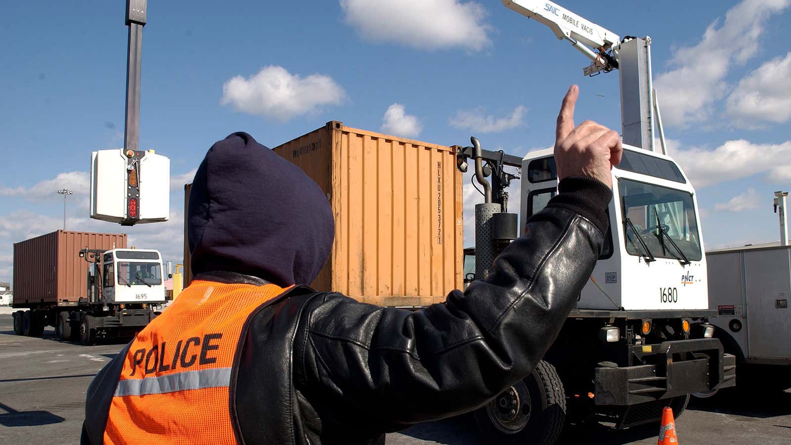 A US customs officer inspects containers at the Port of Newark in 2006.