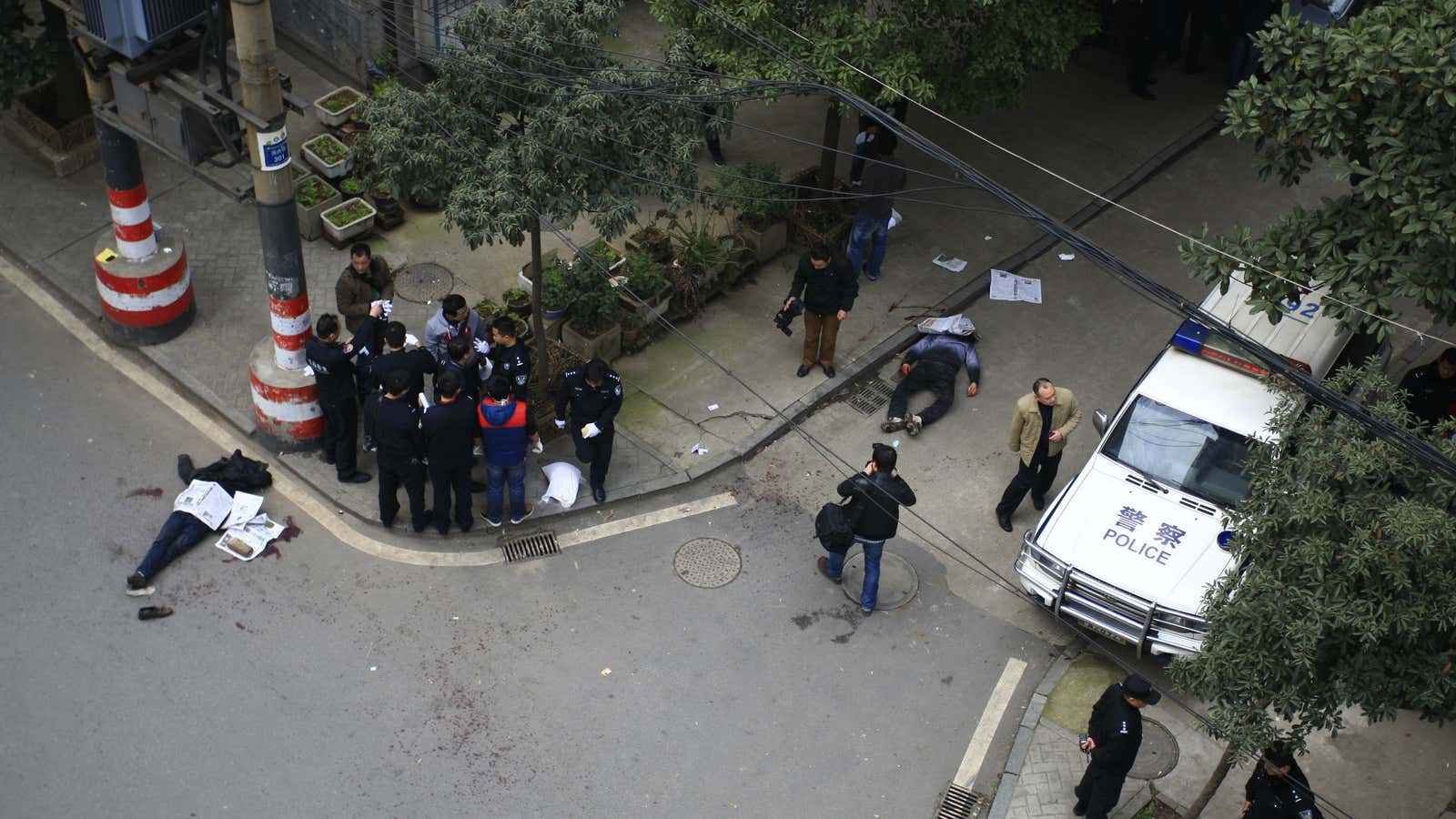 Police stand guard over the crime scene in Changsha, China on March 14.