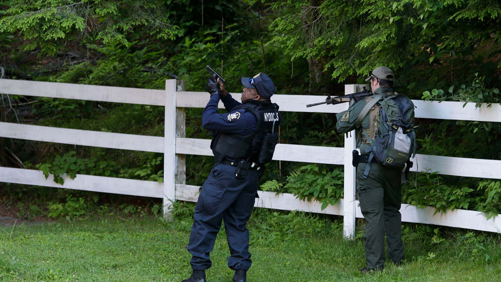 A corrections officer and a forest ranger on the hunt for David Sweat, near where Richard Matt was killed in upstate New York today.