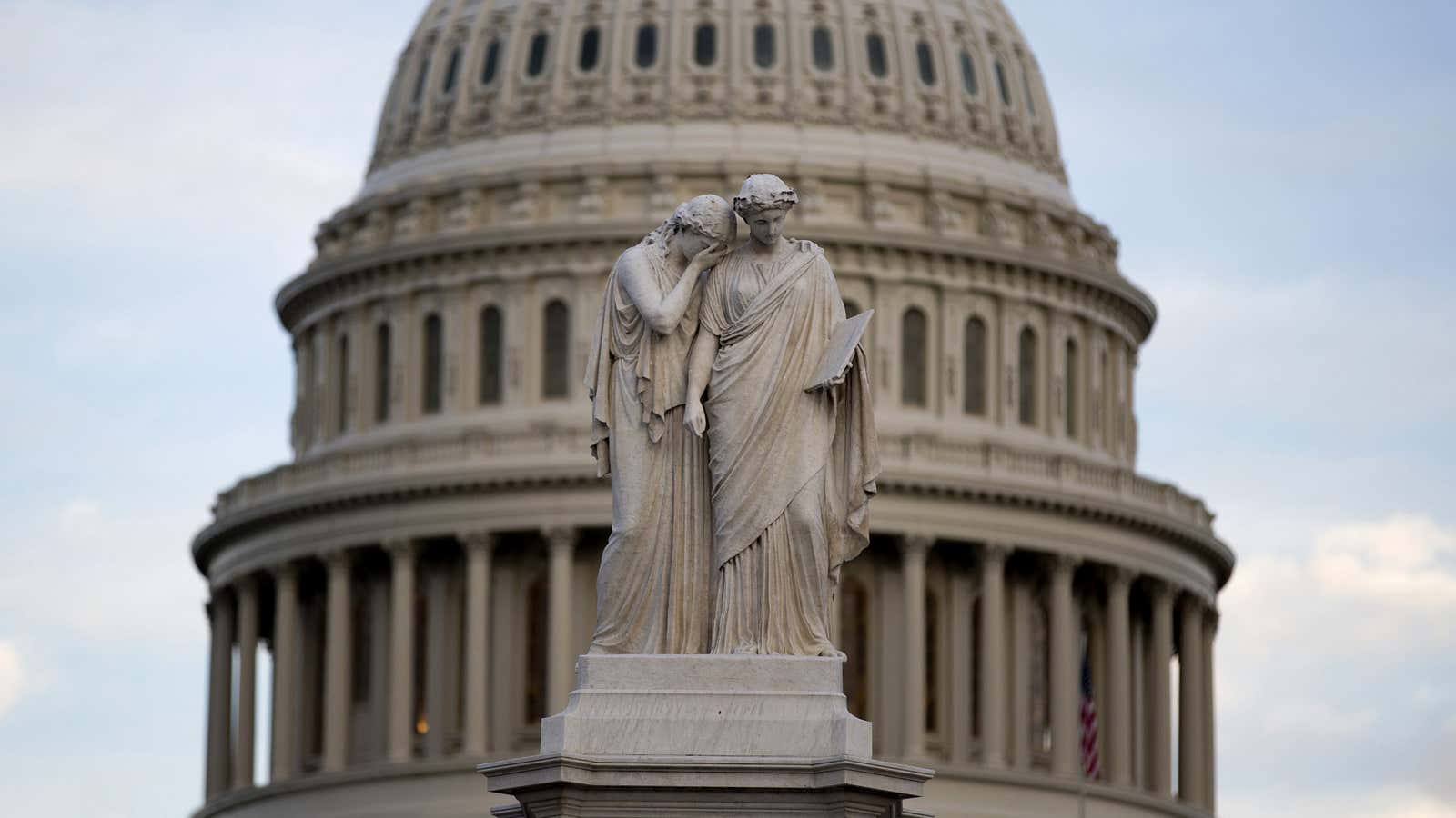 Grief cries on the shoulder of History in a statue near the US Capitol.