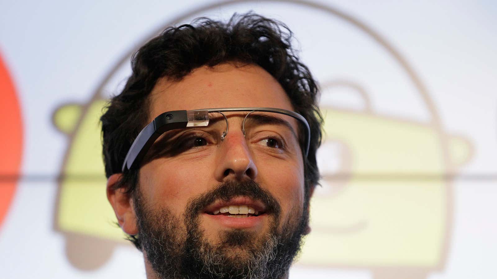 Google CEO Sergei Brin can’t hear you; his Glasses are tuned to a Hangout.