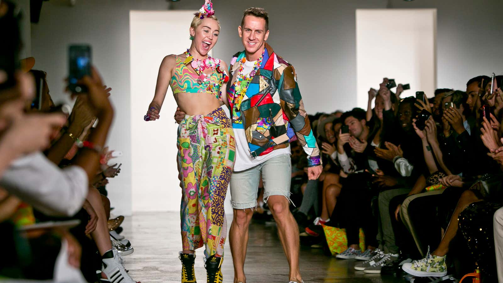 A subtle appearance: Miley Cyrus and designer Jeremy Scott at New York Fashion Week.