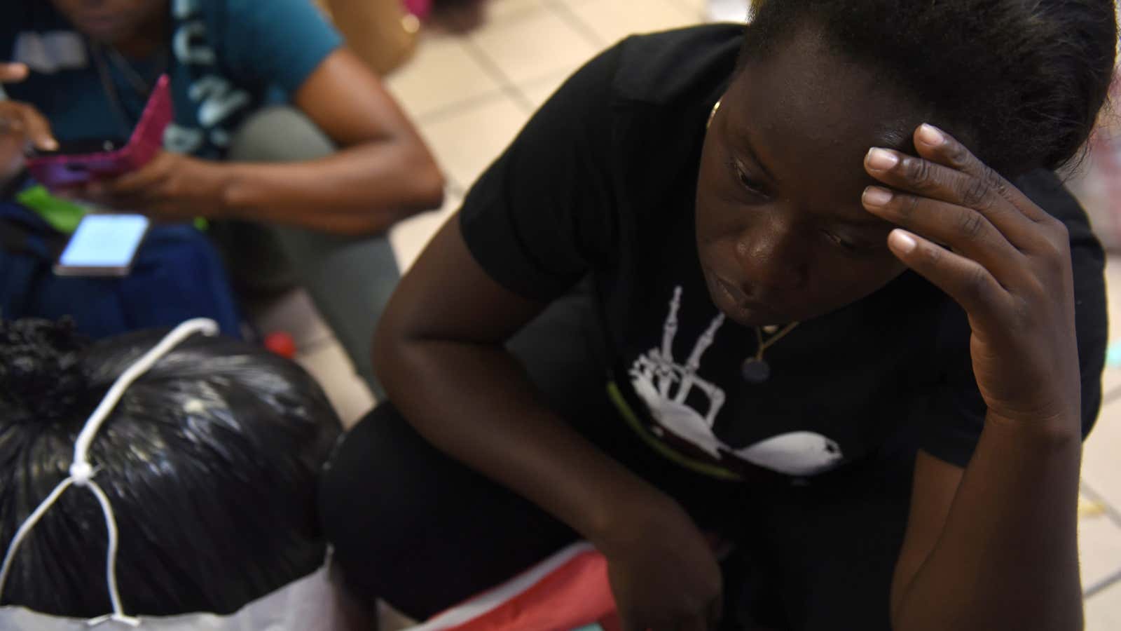 Migrants from Congo and Angola wait at a bus station in San Antonio, Texas, U.S. June 11, 2019.