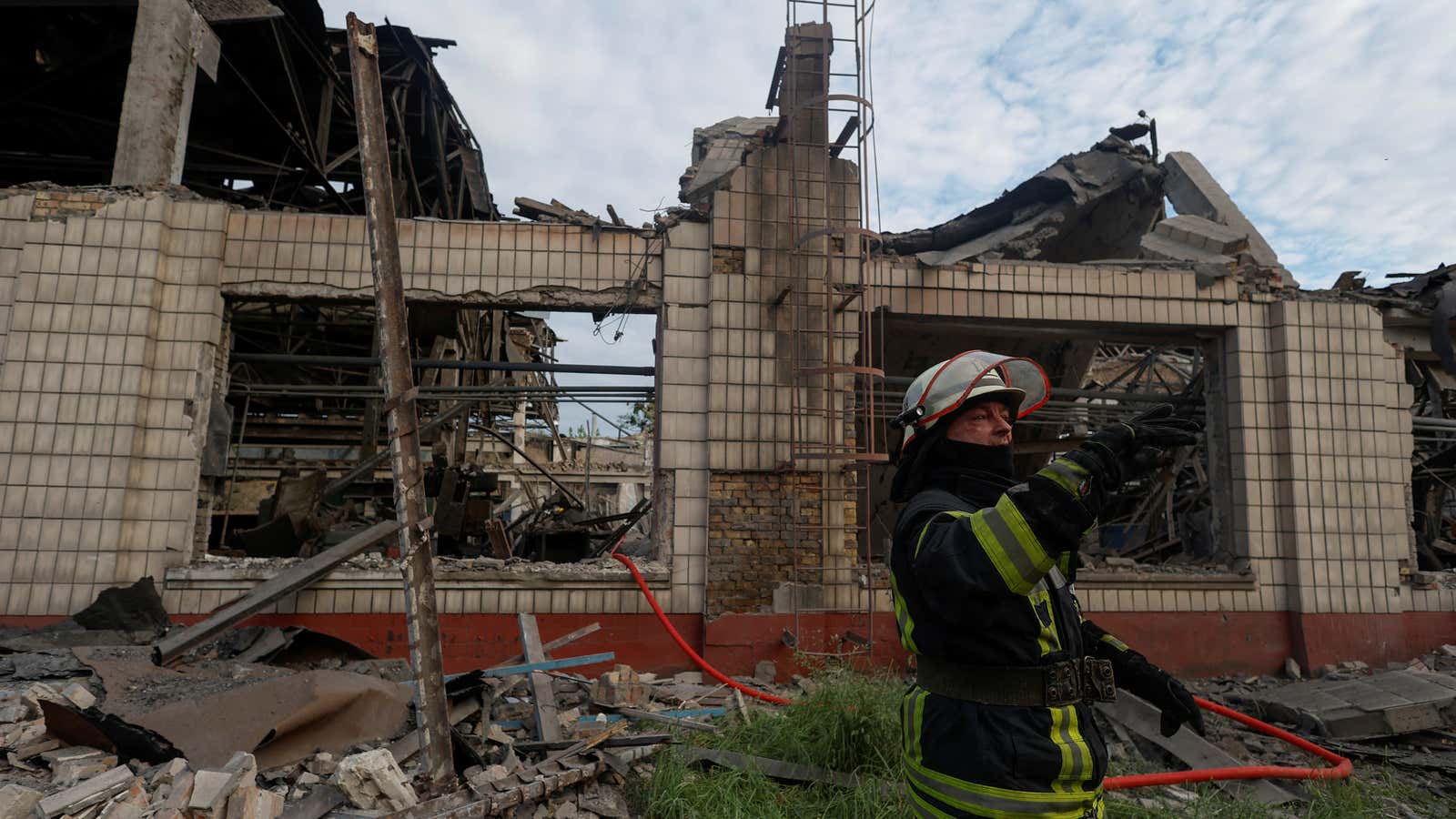 A rescuer works at a site of a facility of the Darnytsia Car Repair Plant damaged by missile strikes, as Russia’s attacks on Ukraine in continues, in Kyiv.