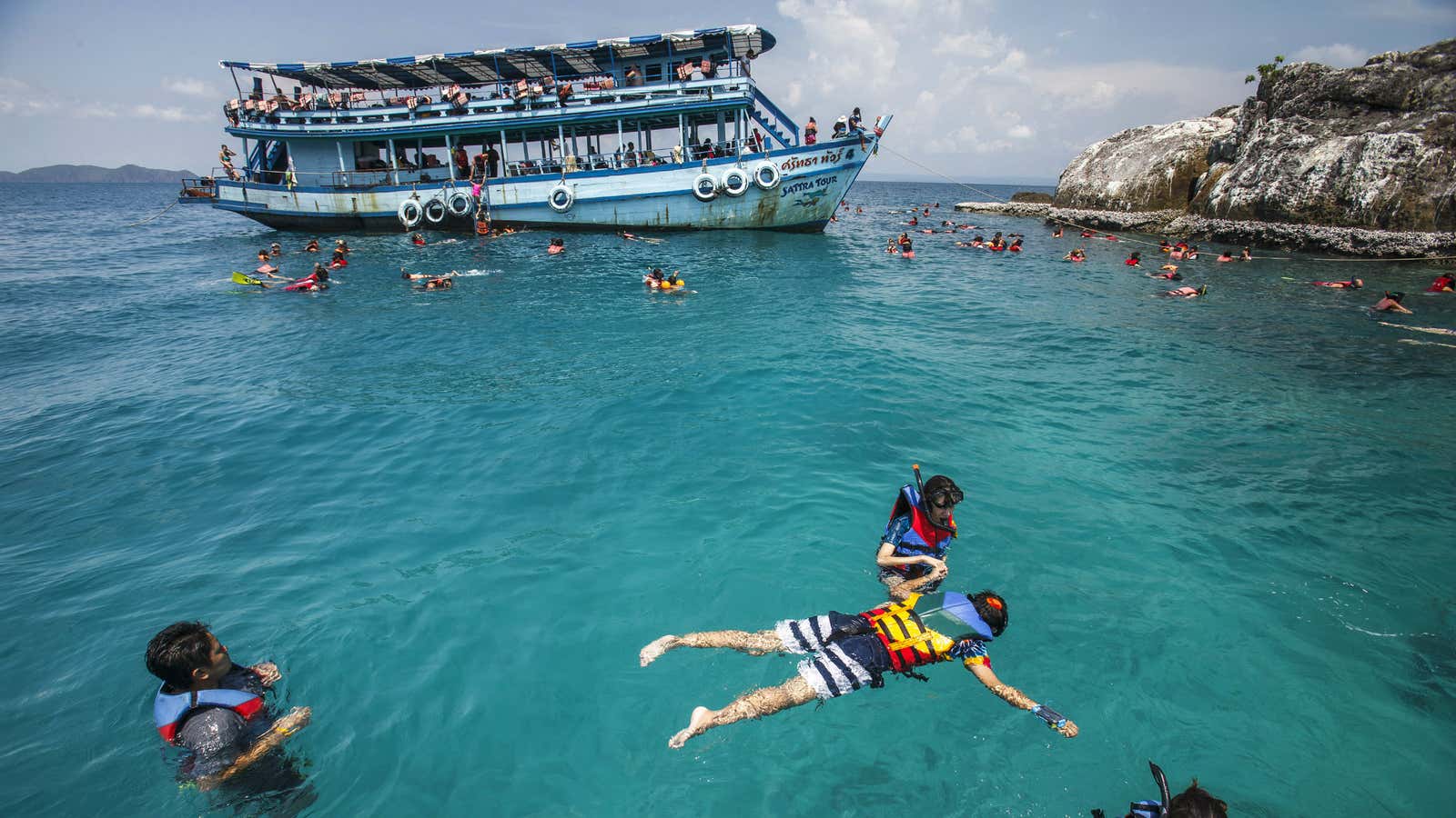 Tourists swim near Kut Island, Thailand.