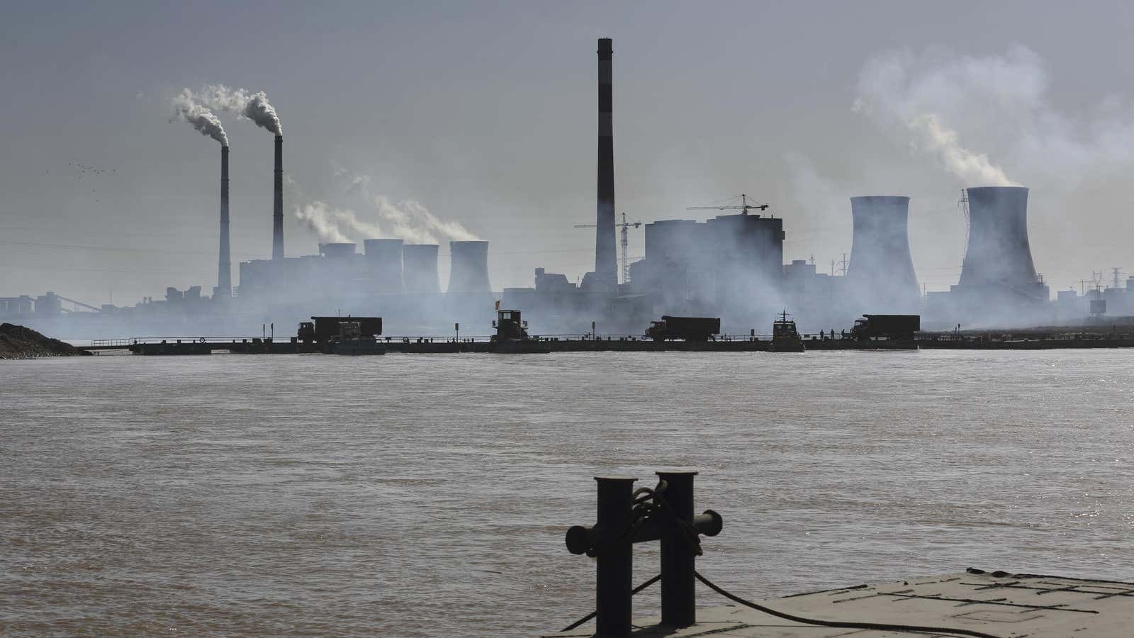 A pontoon bridge across China’s Yellow River is used to transport coal to an industrial park.