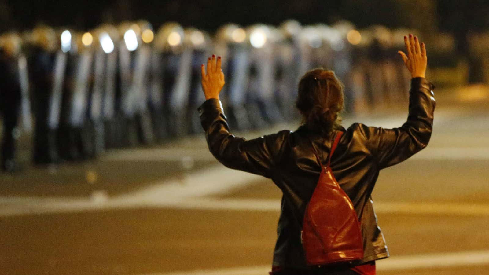 Protesters line the street but Greece surrenders to Europe.