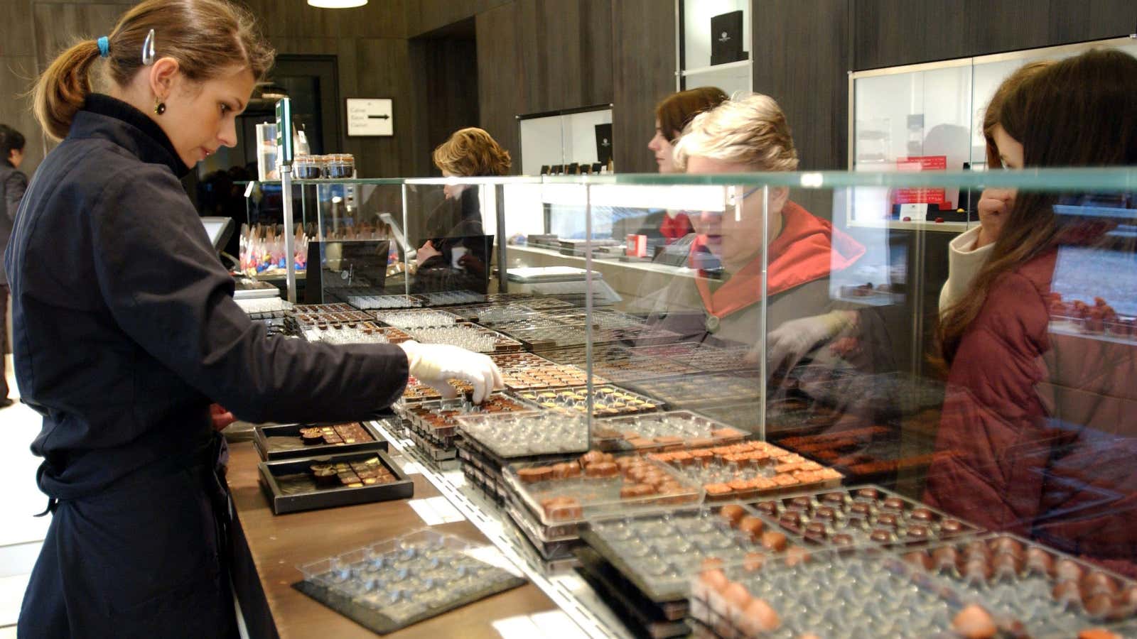 An employee at Belgian chocolatier Pierre Marcolini’s designer shop on Brussels’ Sablon square.