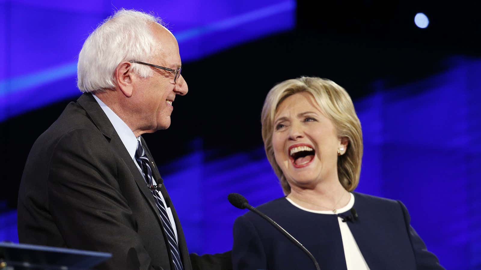 Senator Bernie Sanders, of Vermont, left, and Hillary Rodham Clinton laugh during the CNN Democratic presidential debate, Tuesday, Oct. 13, 2015, in Las Vegas.