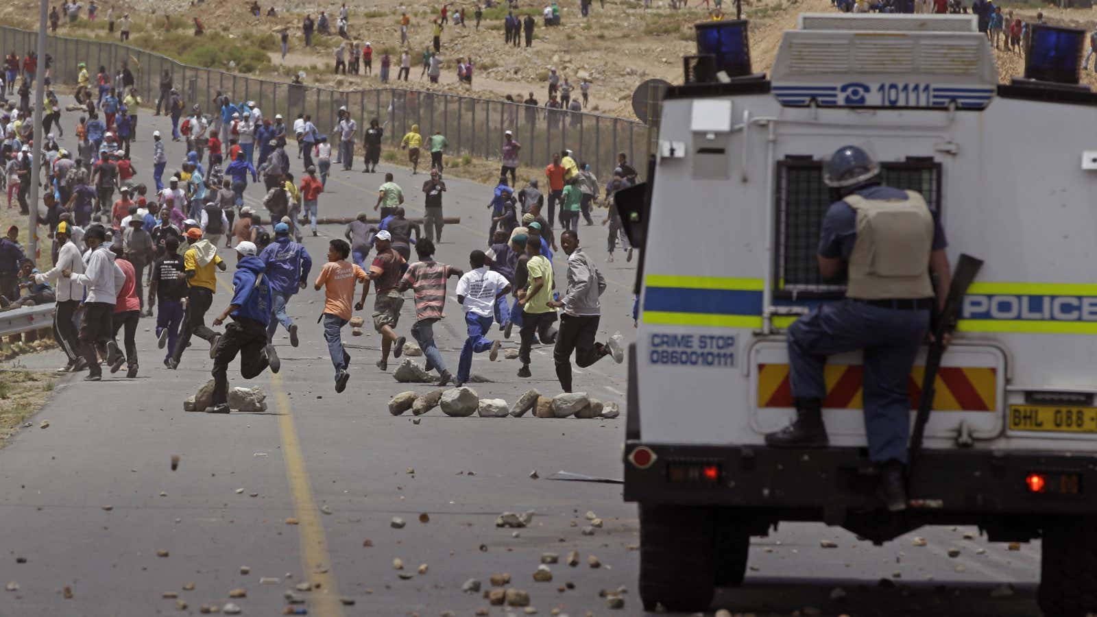 Striking farm workers and police face off in De Doorns, in South Africa’s Western Cape province.