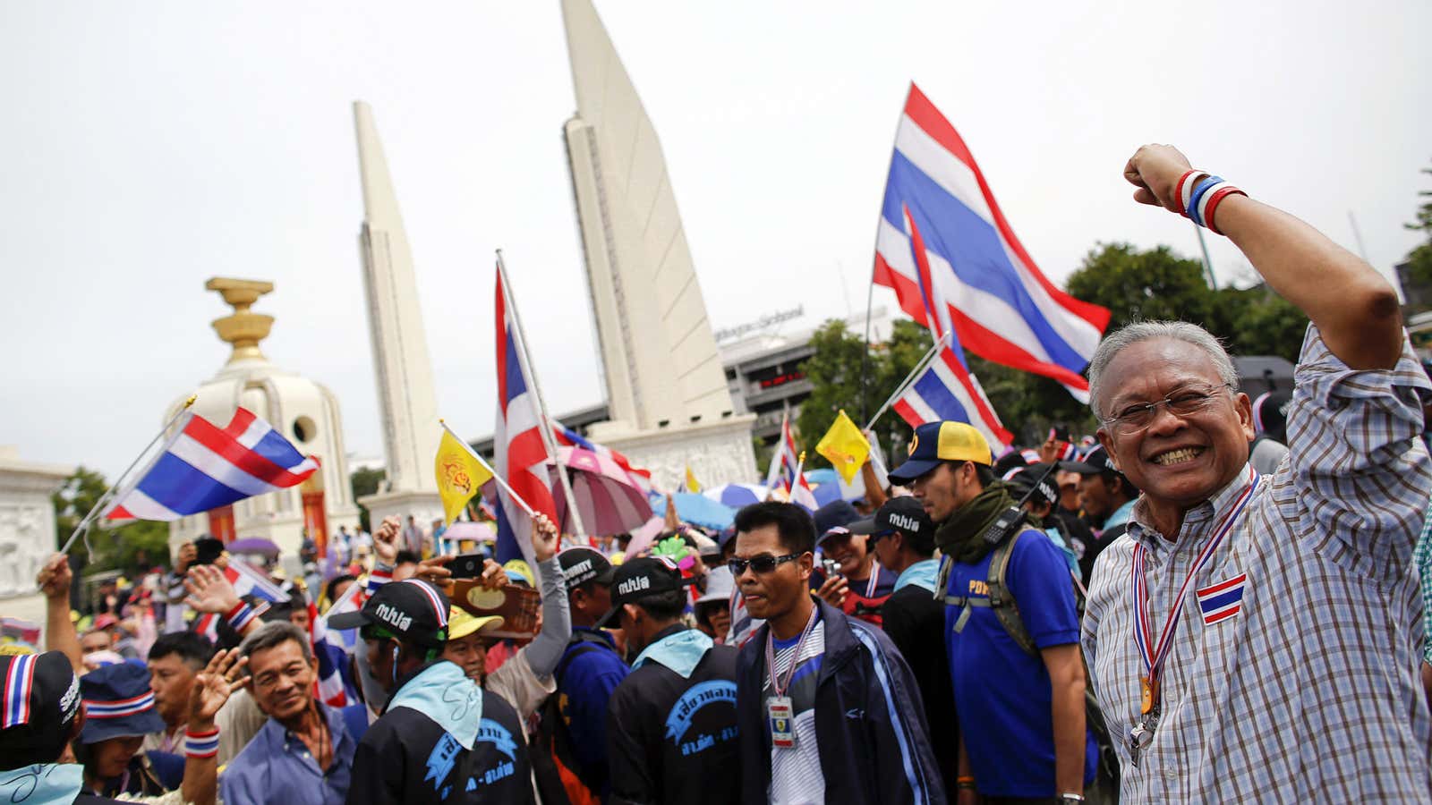 Why is this man—anti-government protest leader Suthep Thaugsuban—smiling?