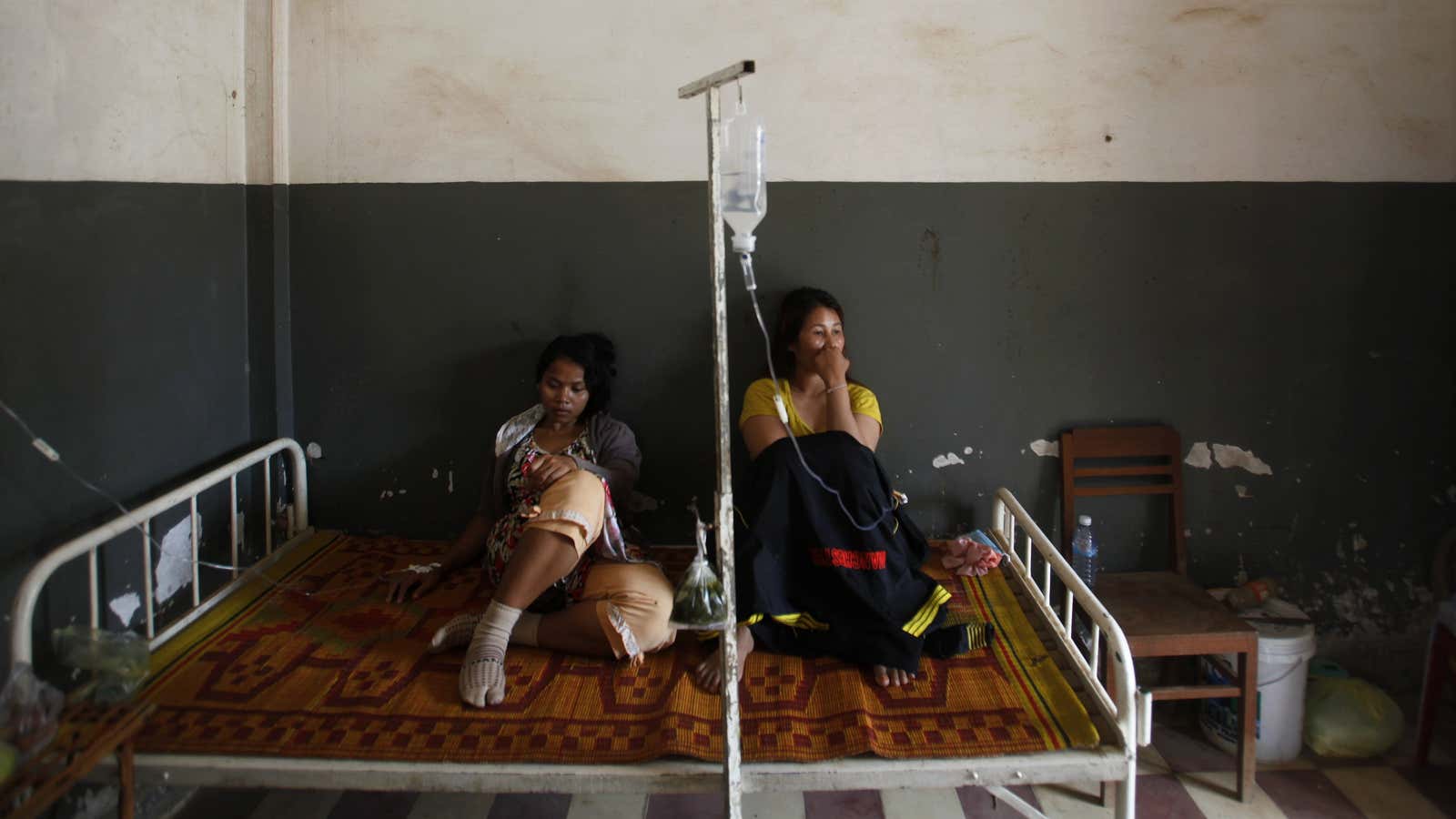 Cambodian garment workers recover after a mass fainting.