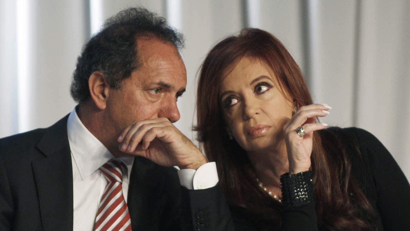 Daniel Scioli (left) is Kirchner’s favorite to succeed her—but he can’t probably can’t protect her from a slew of lawsuits waiting in the wings.