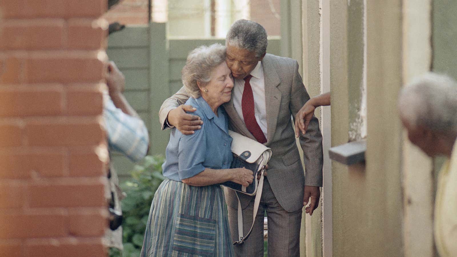 Former politicians Helen Suzman and Nelson Mandela share an embrace.