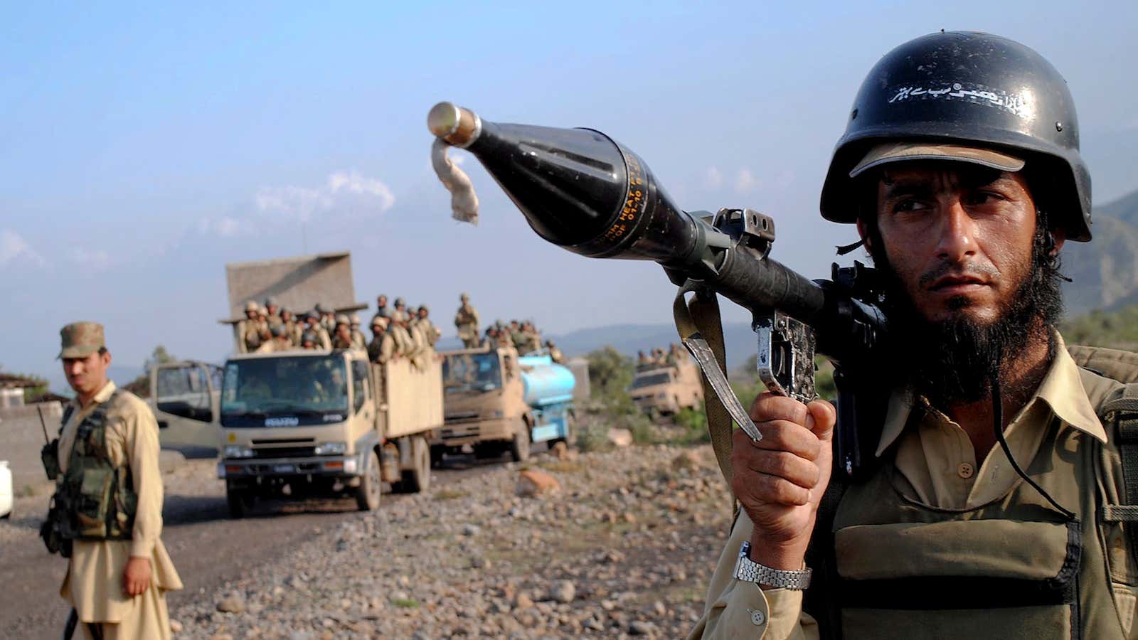 A soldier secure an area as other troops move toward a forward base during a military operation against militants in Pakistan.