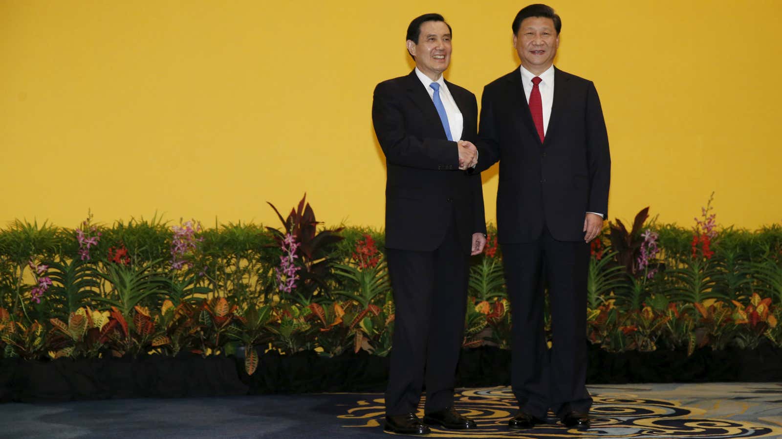 Chinese President Xi Jinping shakes hands with Taiwan’s President Ma Ying-jeou.