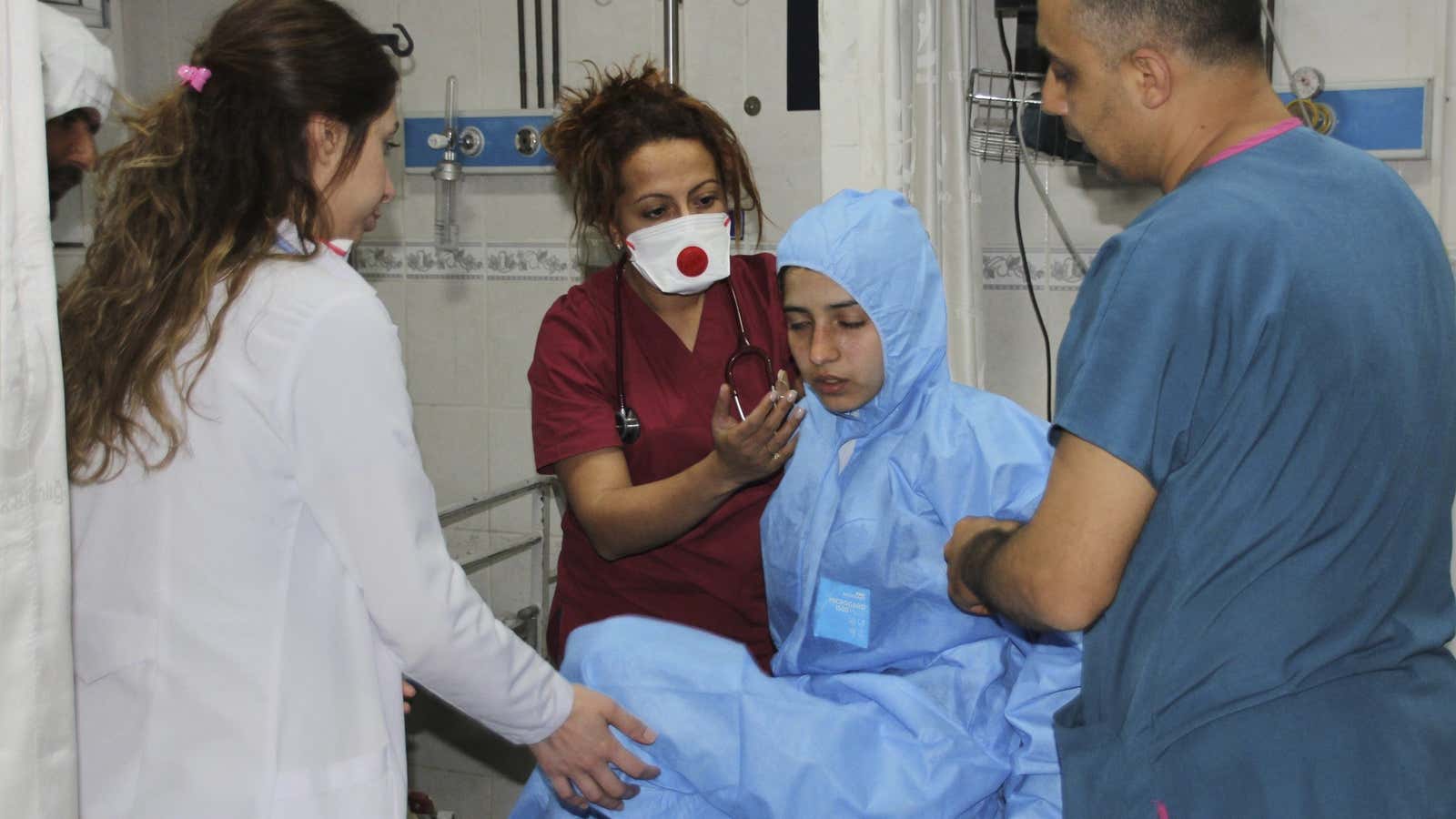 A victim is examined by medics.