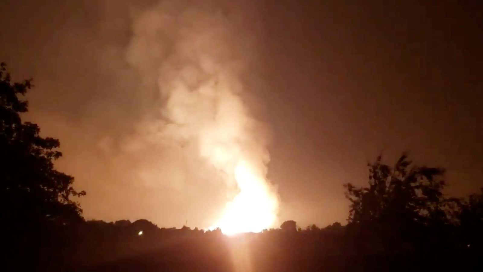 Flames light up the sky after an Enbridge gas pipeline explosion in rural Moreland, Kentucky, U.S., August 1, 2019.