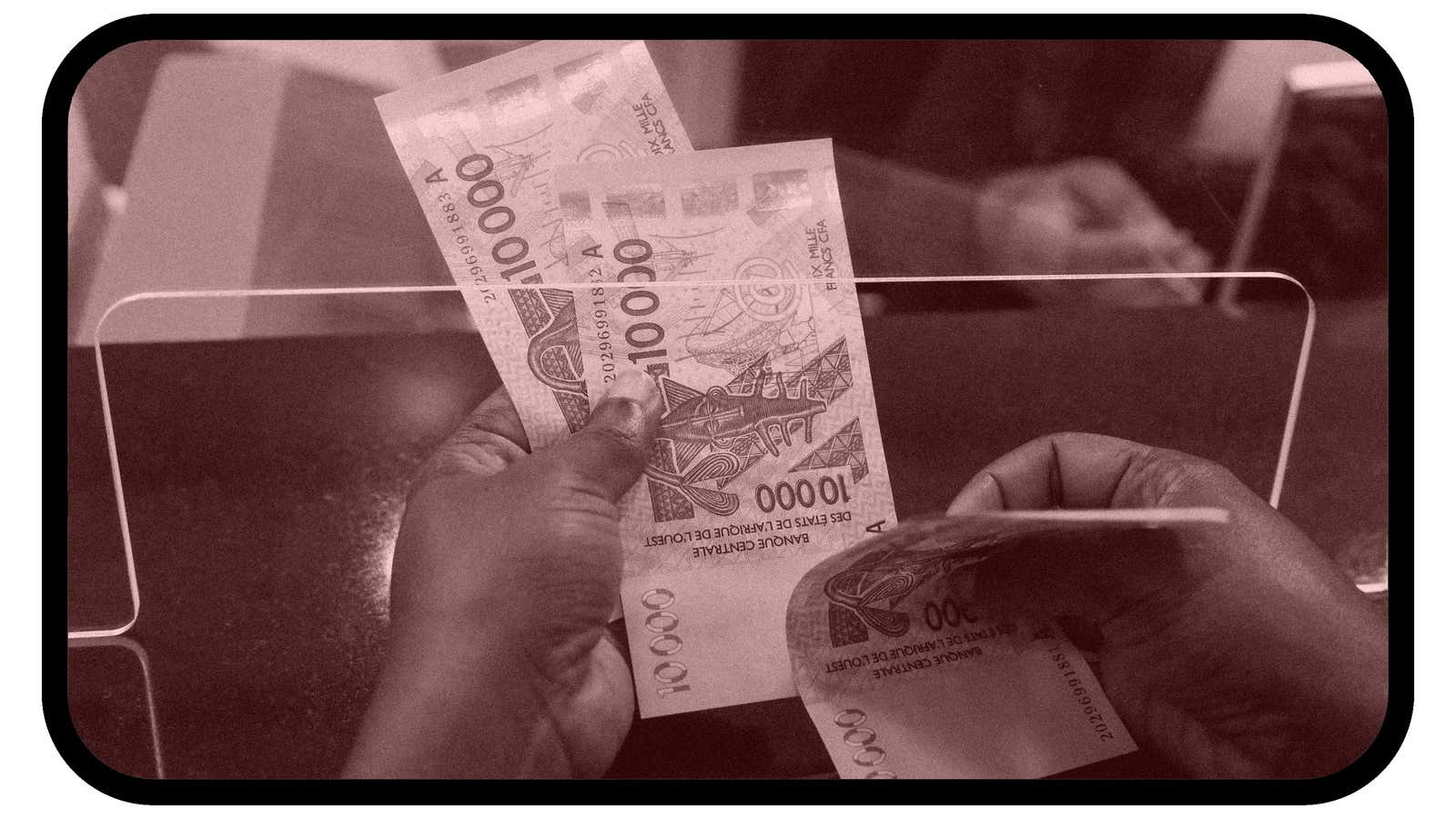 Photo of person shuffling cash in Senegal bank.