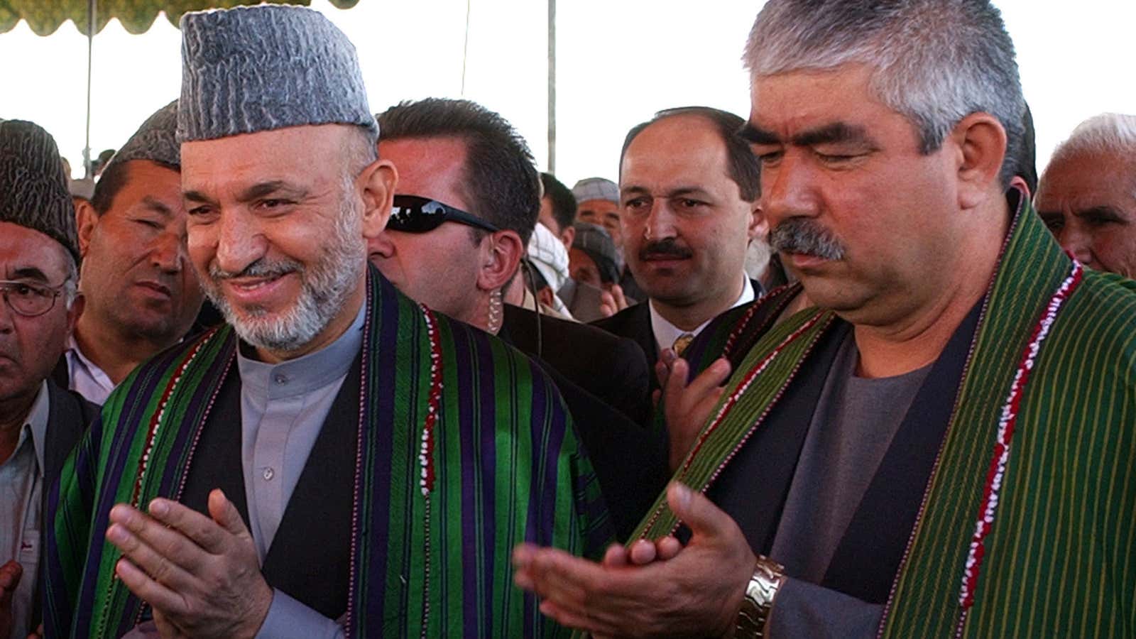 What Dostum, right, looks like when he is happy.