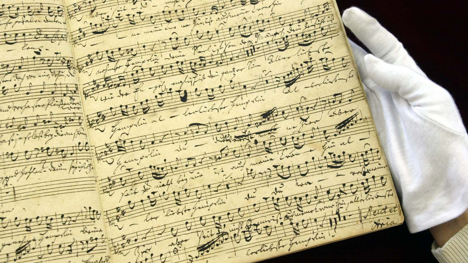 Part of a 1728 musical score composed by Johann Sebastian Bach, which has been found in Japan nearly 80 years after it went missing, is shown at Kunitachi College of Music in Tokyo April 6, 2004. The “Wedding Cantata BWV216”, composed in 1728, was found in the possesion of Japanese pianist Chieko Hara who died in December 2001, said the college professor, who determined the authenticity of the Bach piece and whose view was shared by other researchers. REUTERS/Yuriko Nakao  YN/TW – RP4DRIIDGYAA