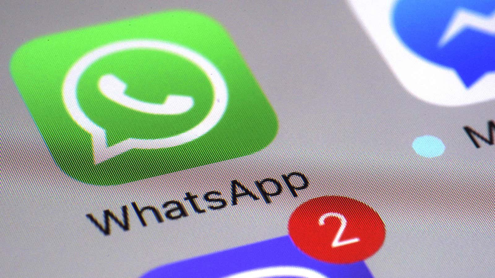 WhatsApp appears on a smartphone,