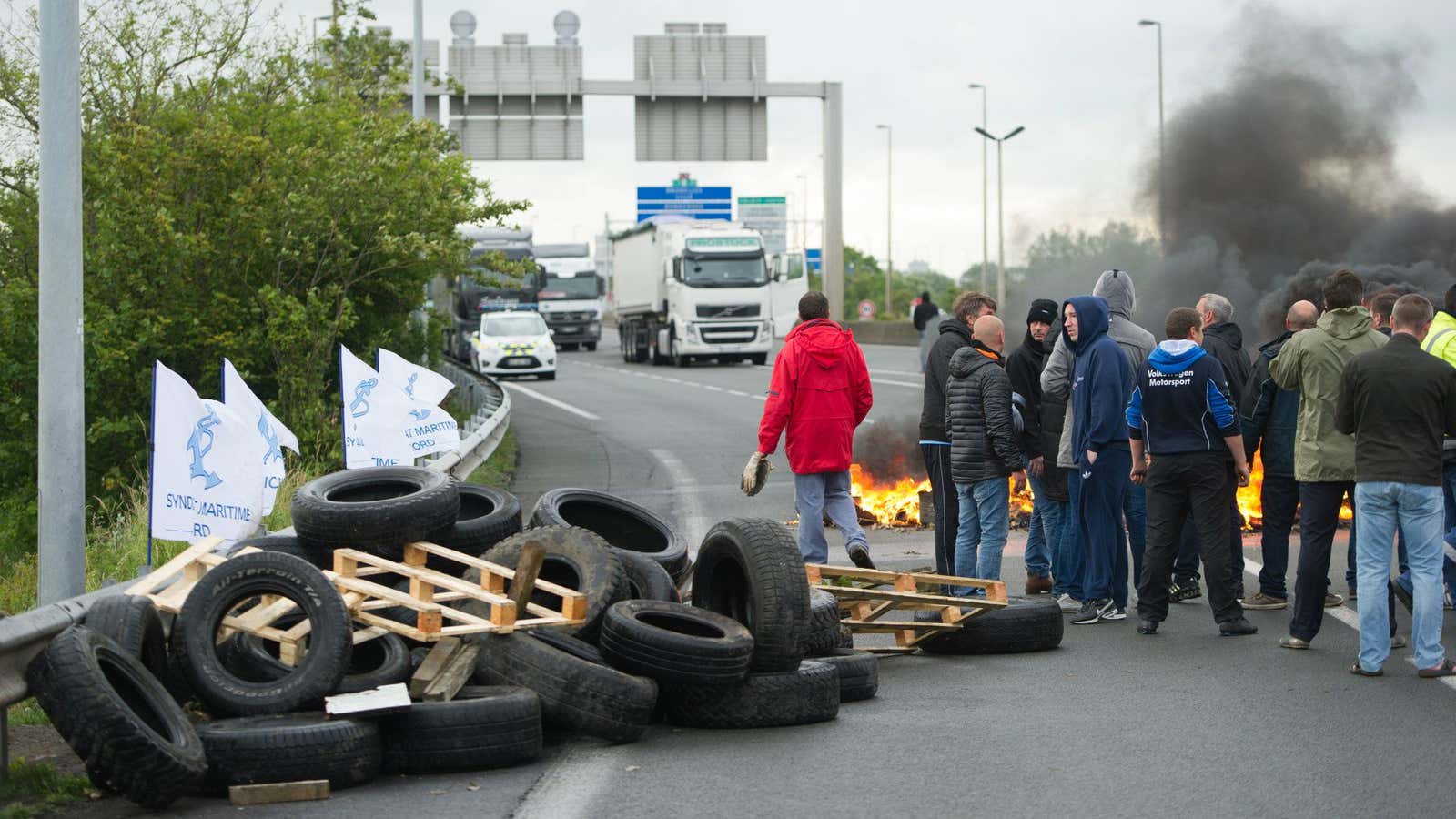 Striking ferry workers block a ramp leading to the Channel Tunnel.