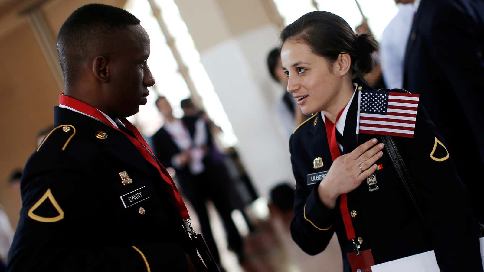 Immigrants and US Army Specialists Amadou Berry (L) from Guinea and Rasmus Ulberg from Samoa after a naturalization ceremony at the Ellis Island Museum of Immigration.