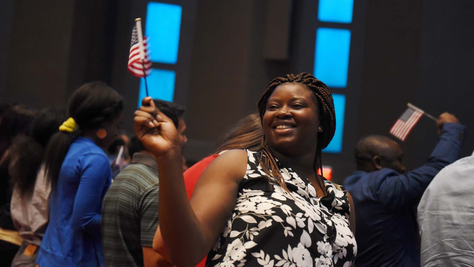 A Congolese-American celebrates at a naturalization ceremony