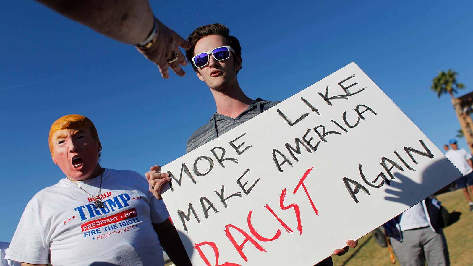 Trump supporters scream at an anti-Trump demonstrator