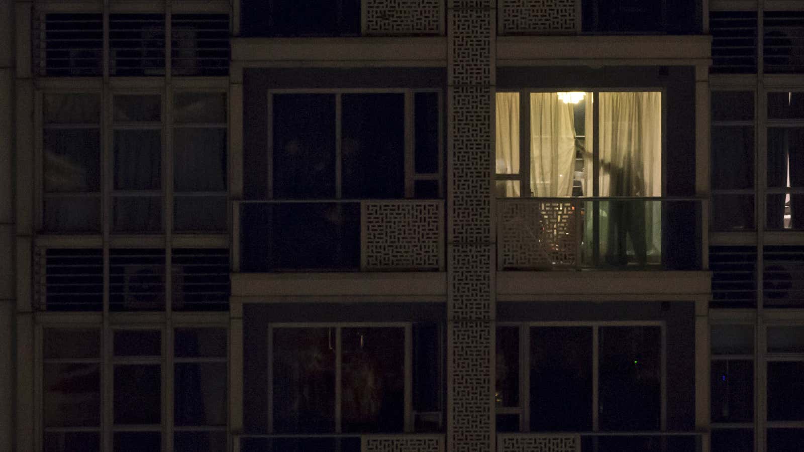 Police search the Wan Chai apartment where two murdered women were found.