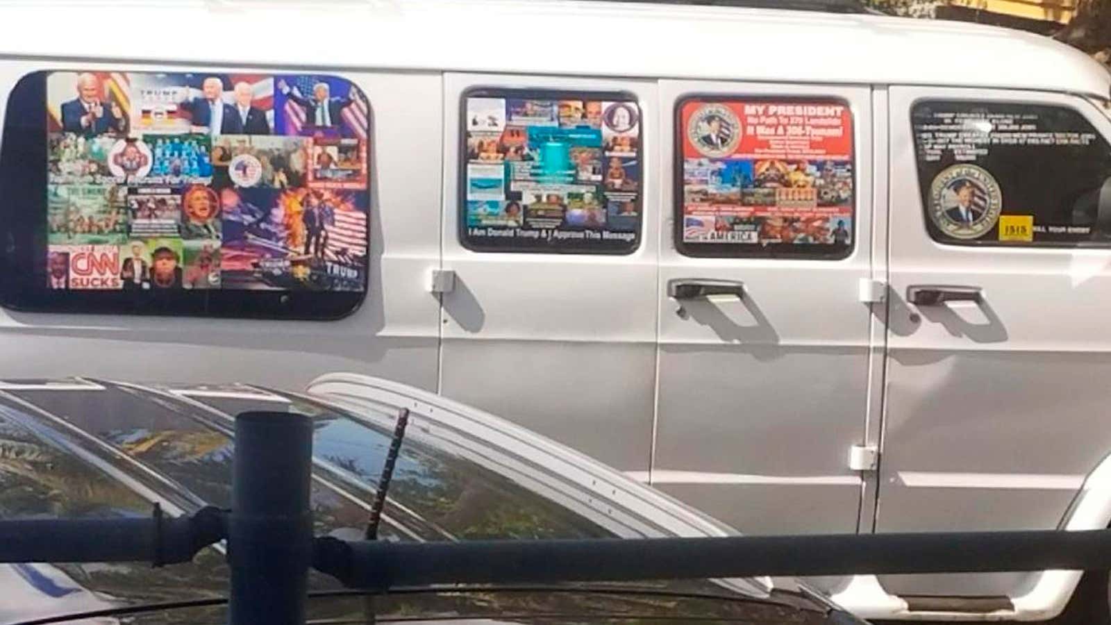 This Nov. 1, 2017, photo shows a van with windows covered with an assortment of stickers in Well, Fla. Federal authorities took Cesar Sayoc into custody on Friday, Oct. 26, 2018, and confiscated his van, which appears to be the same one, at an auto parts store in Plantation, Fla., in connection with the mail-bomb scare that has targeted prominent Democrats from coast to coast. (Courtesy of Lesley Abravanel via AP)