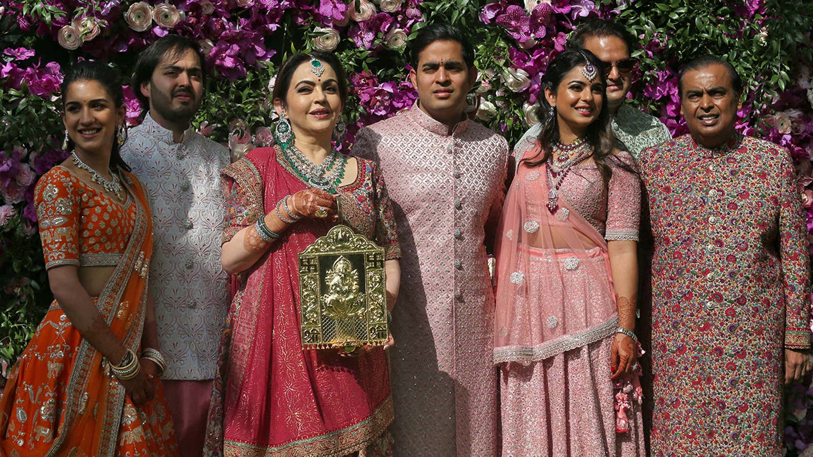 FILE PHOTO: (L-R) Radhika Merchant, Anant Ambani, Nita Ambani, Akash Ambani, Isha Piramal, Anand Piramal and Mukesh Ambani, the Chairman of Reliance Industries, pose during a photo opportunity at the wedding ceremony of Akash, at Bandra-Kurla Complex in Mumbai, India, March 9, 2019. REUTERS/Francis Mascarenhas/File Photo