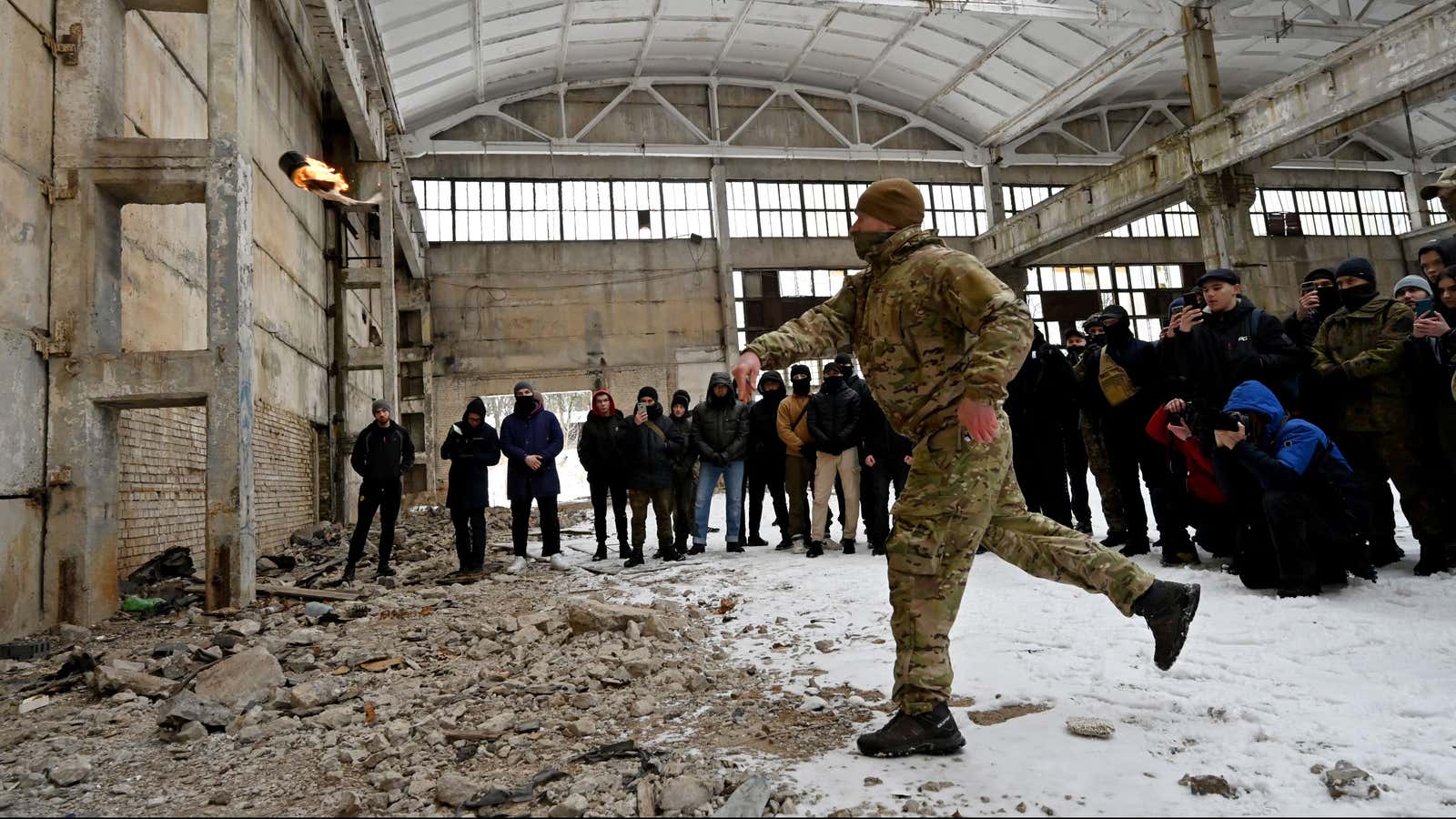 A Ukrainian military instructor teaches civilians to use Molotov cocktails.