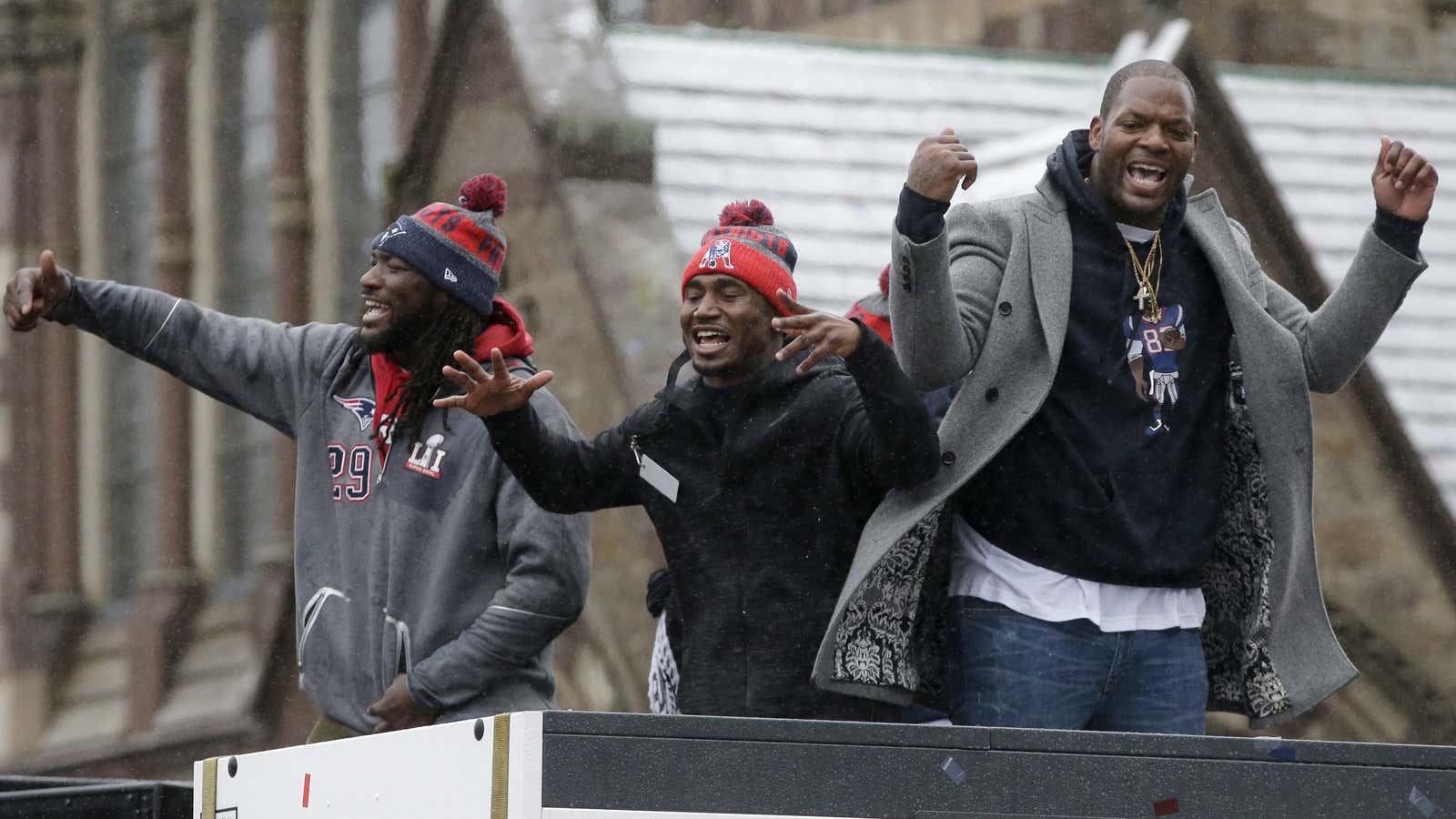 New England Patriots players celebrate their Super Bowl Victory at a parade in Boston.