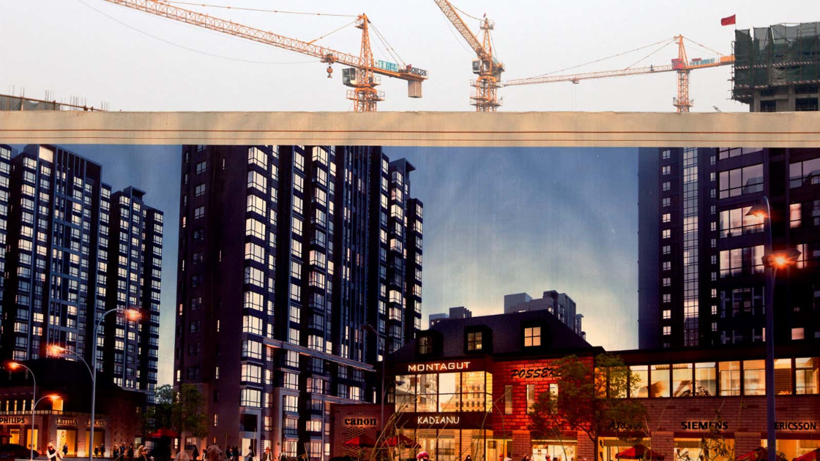 In Beijing, cranes loom above an image of the apartment and shopping complex being built.