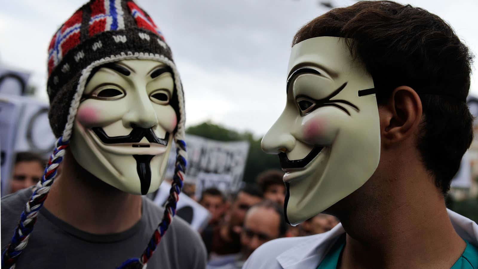 Masked demonstrators at a protest in Spain