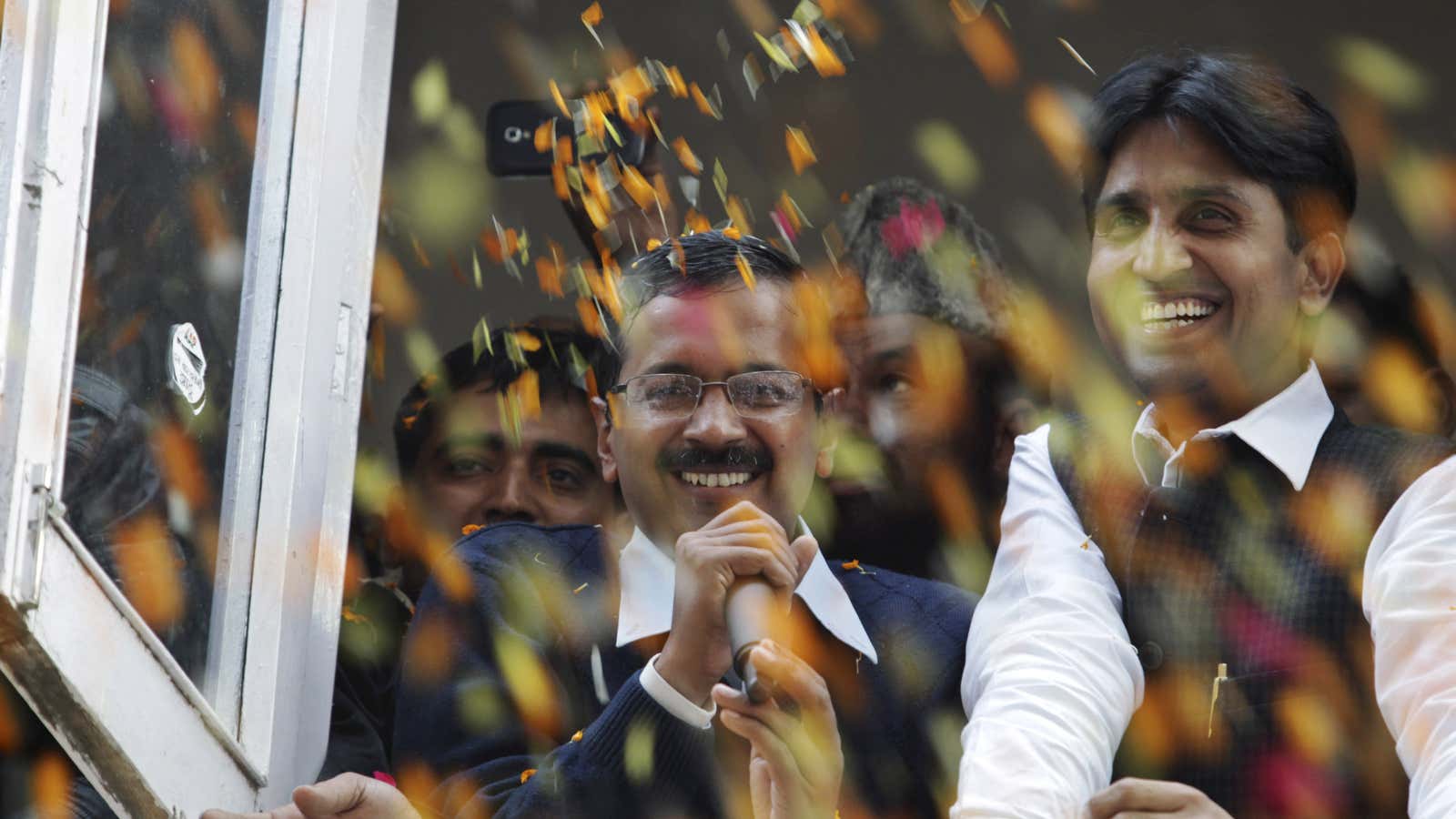 Arvind Kejriwal, center, wooed voters with a party devoted to clean, corruption-free government.