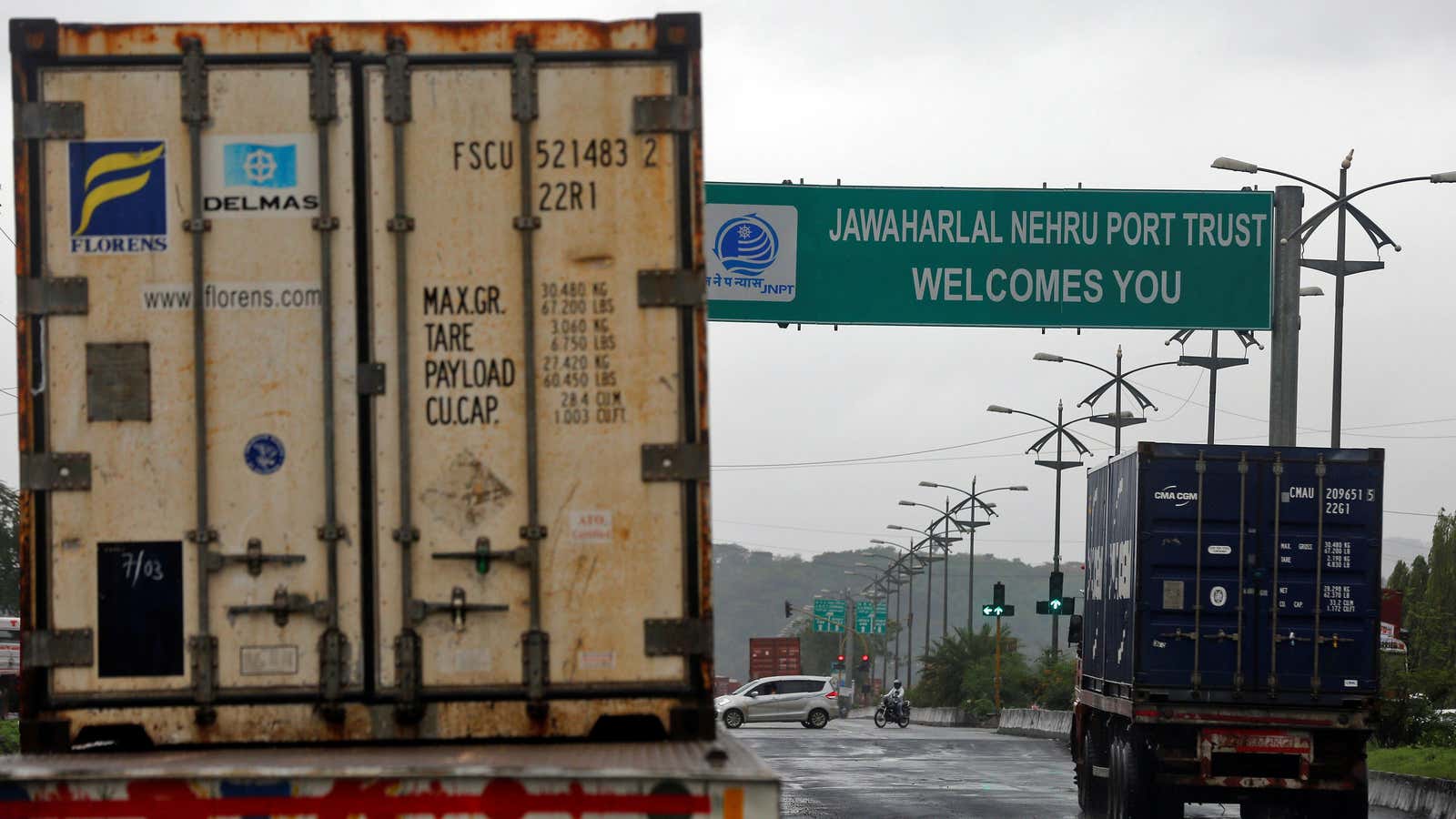 Trucks carrying containers enter the Jawaharlal Nehru Port Trust (JNPT) on the outskirts of Mumbai, India June 28, 2017. REUTERS/Shailesh Andrade