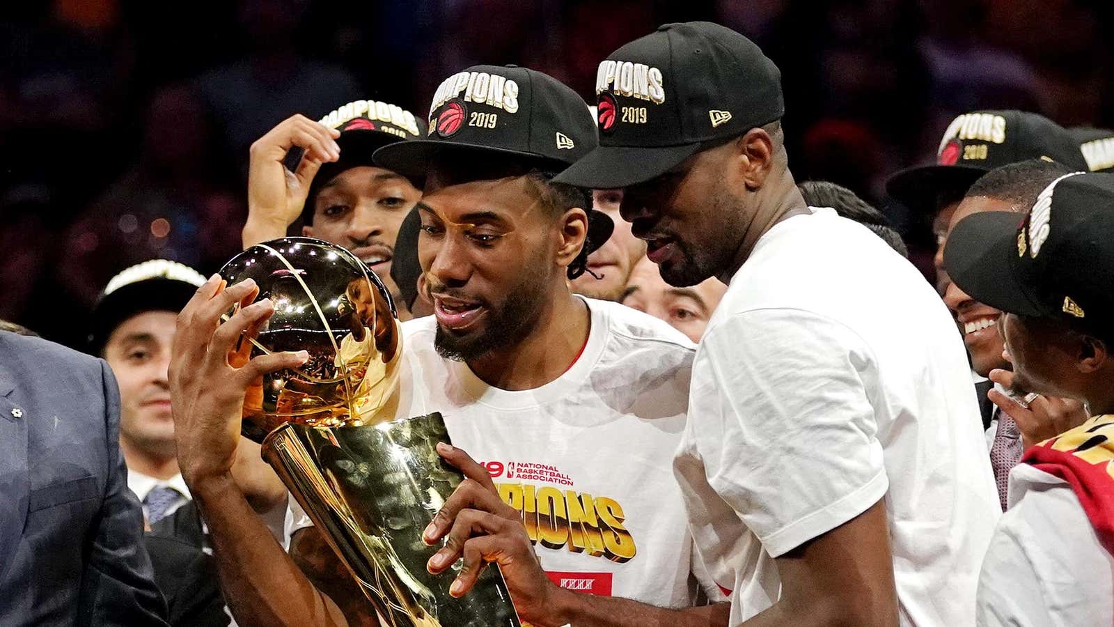 Toronto’s Kawhi Leonard and Serge Ibaka celebrate their win.