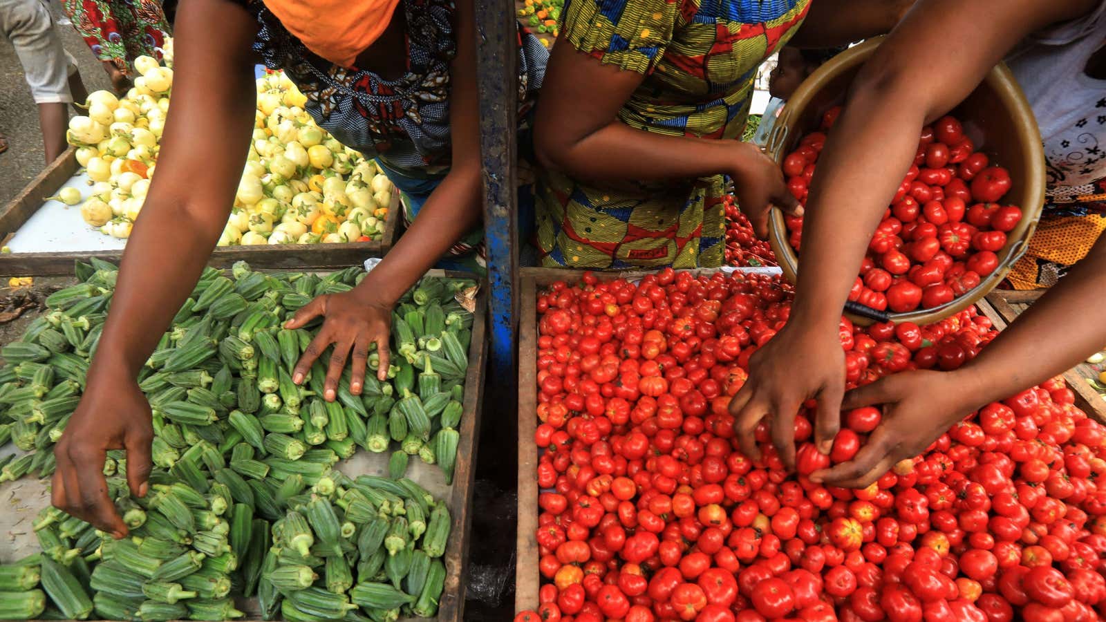 Vegetable sellers are seen in a market amid the coronavirus disease outbreak in Adjame a neighburhood of Abidjan, Ivory Coast June 18, 2020.