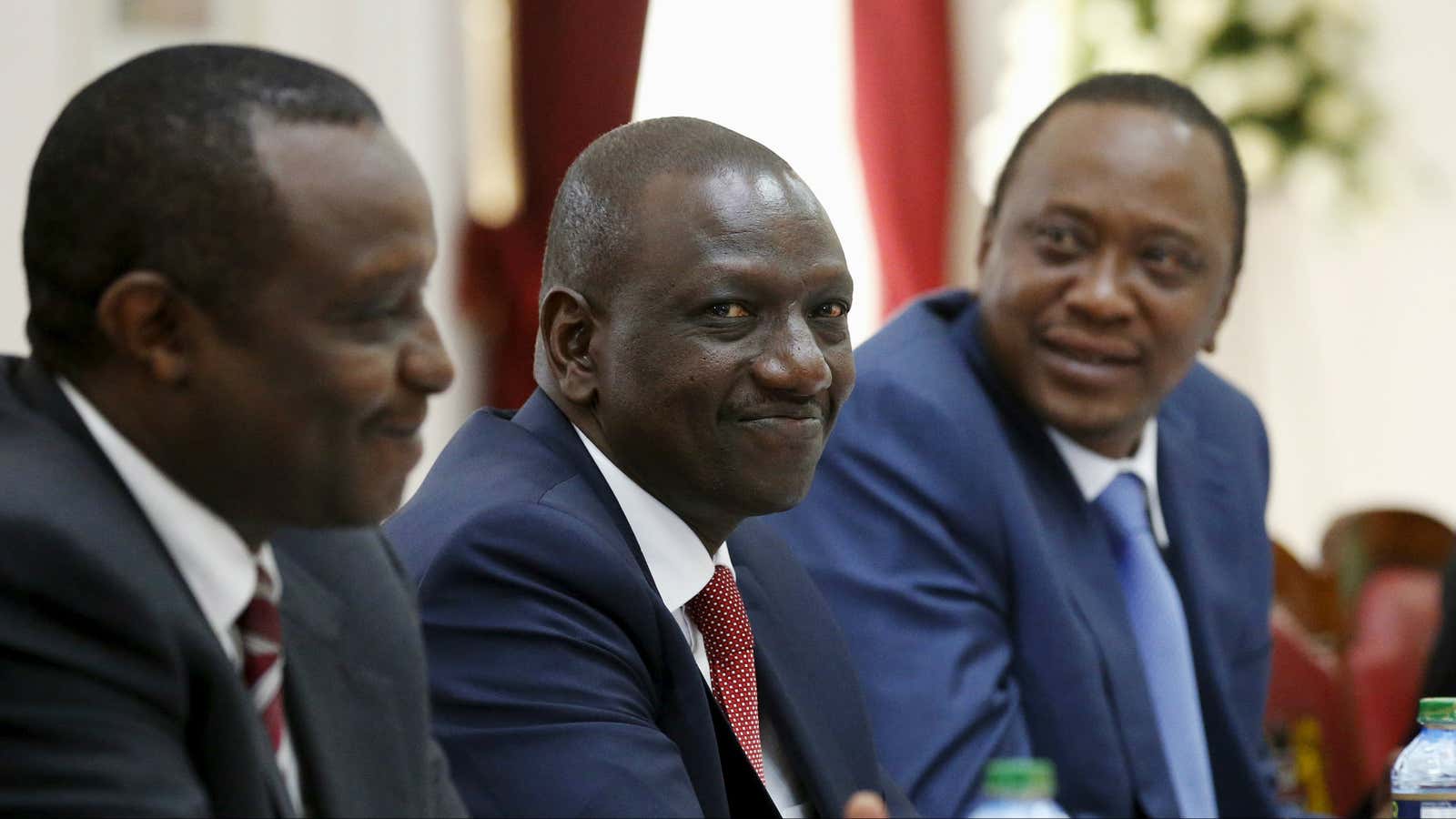 Kenya’s deputy president William Ruto (C) with his boss president Uhuru Kenyatta (R) .