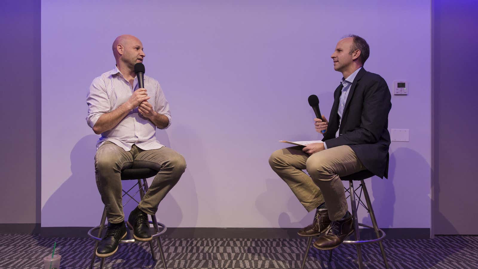 Joe Lubin, left, speaks at a Quartz and Retro Report event with Quartz editor-in-chief Kevin Delaney.