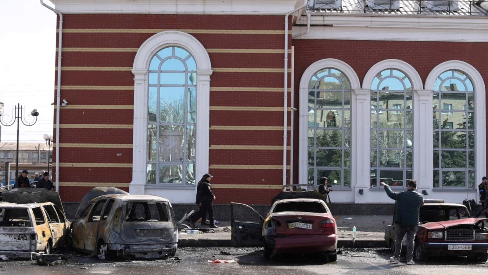 Damaged cars and debris are shown outside of a railway station in Kramatorsk, Ukraine.