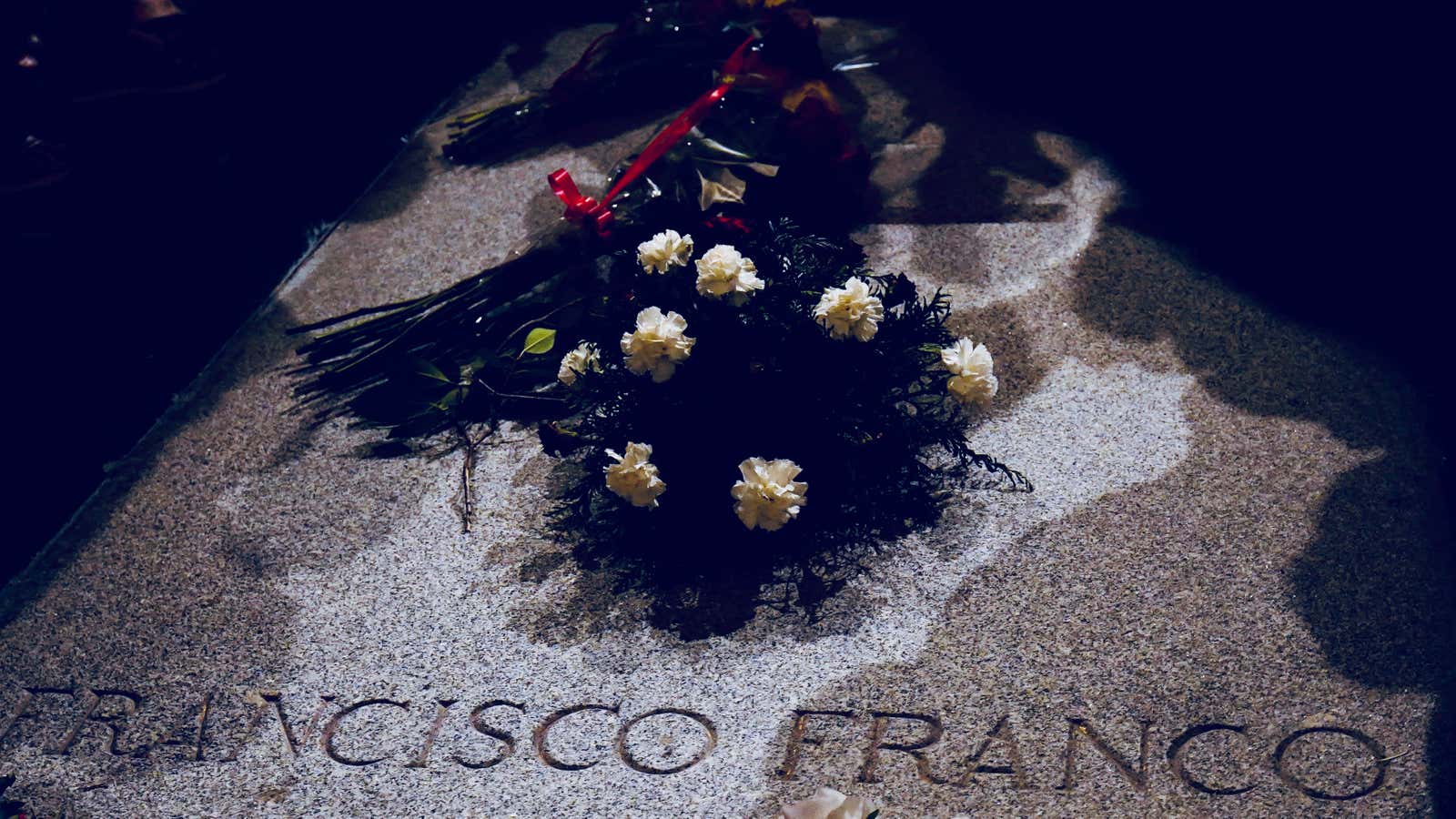 Flowers at his current tomb.