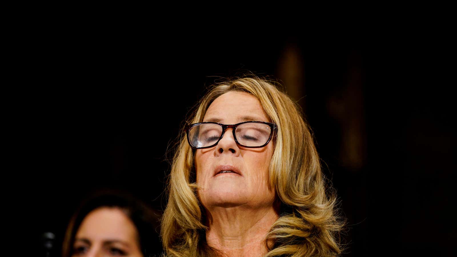 Christine Blasey Ford takes a breath.