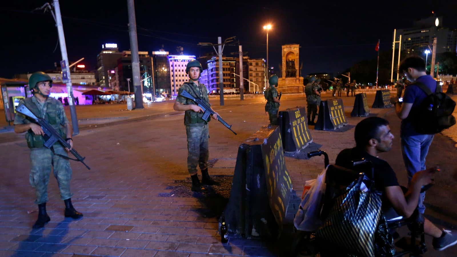 Turkish military stand guard near Taksim Square in Istanbul following a coup against the government of president Erdogan.