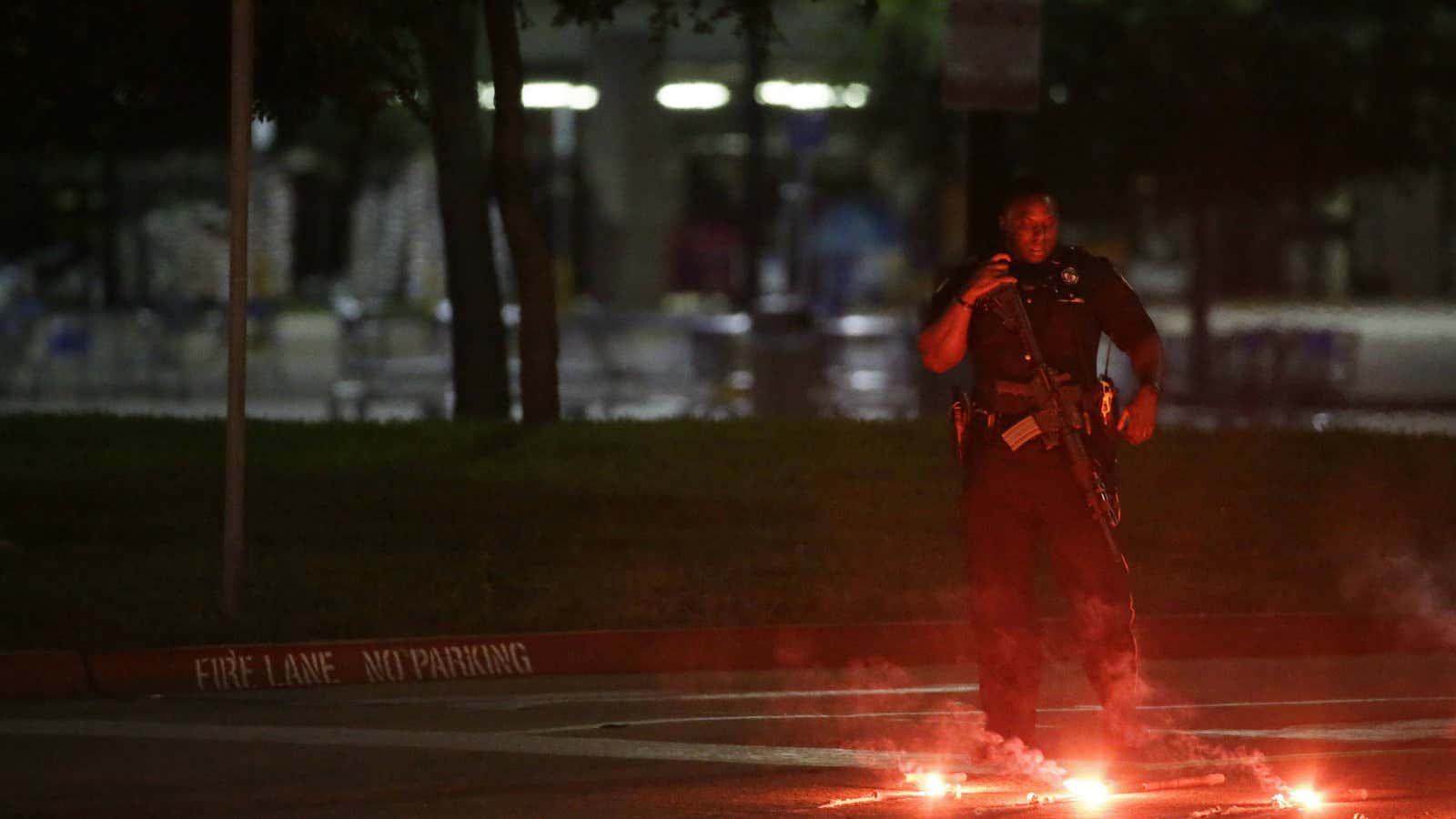 An armed police officer stands guard in Garland.