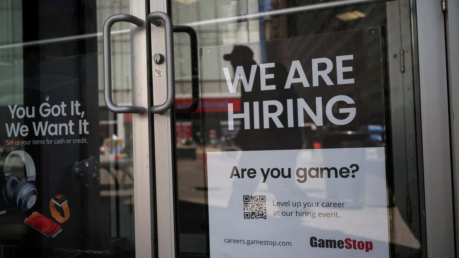 A sign for hire is posted on the door of a GameStop in New York City, U.S., April 29, 2022.